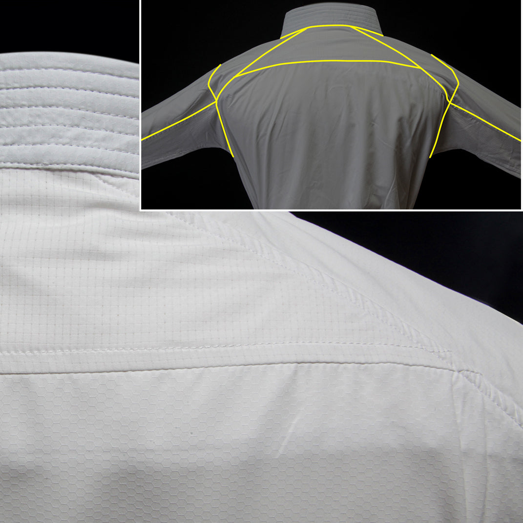 White karate jacket with yellow stitching details on a black background
