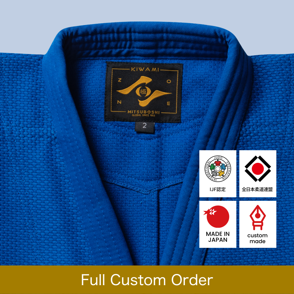 Blue judo jacket with a Zone logo on a light blue background