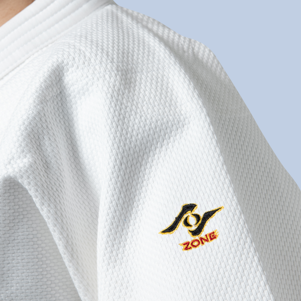 white judo jacket closed up with Zone logo