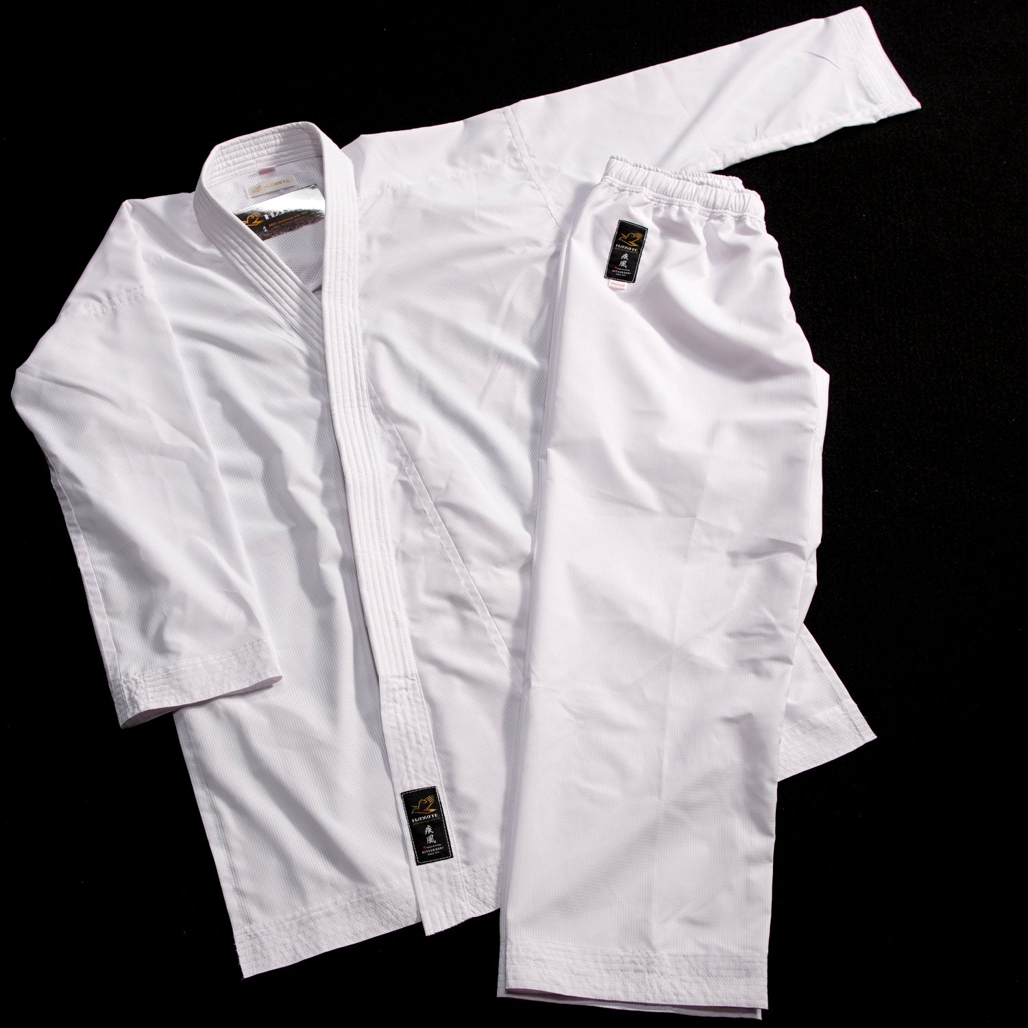 White martial arts uniform on a black background