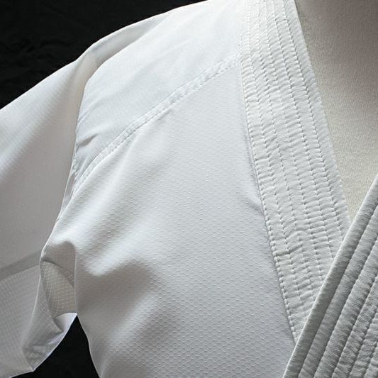 Close-up of a Hayate white martial arts uniform with textured fabric