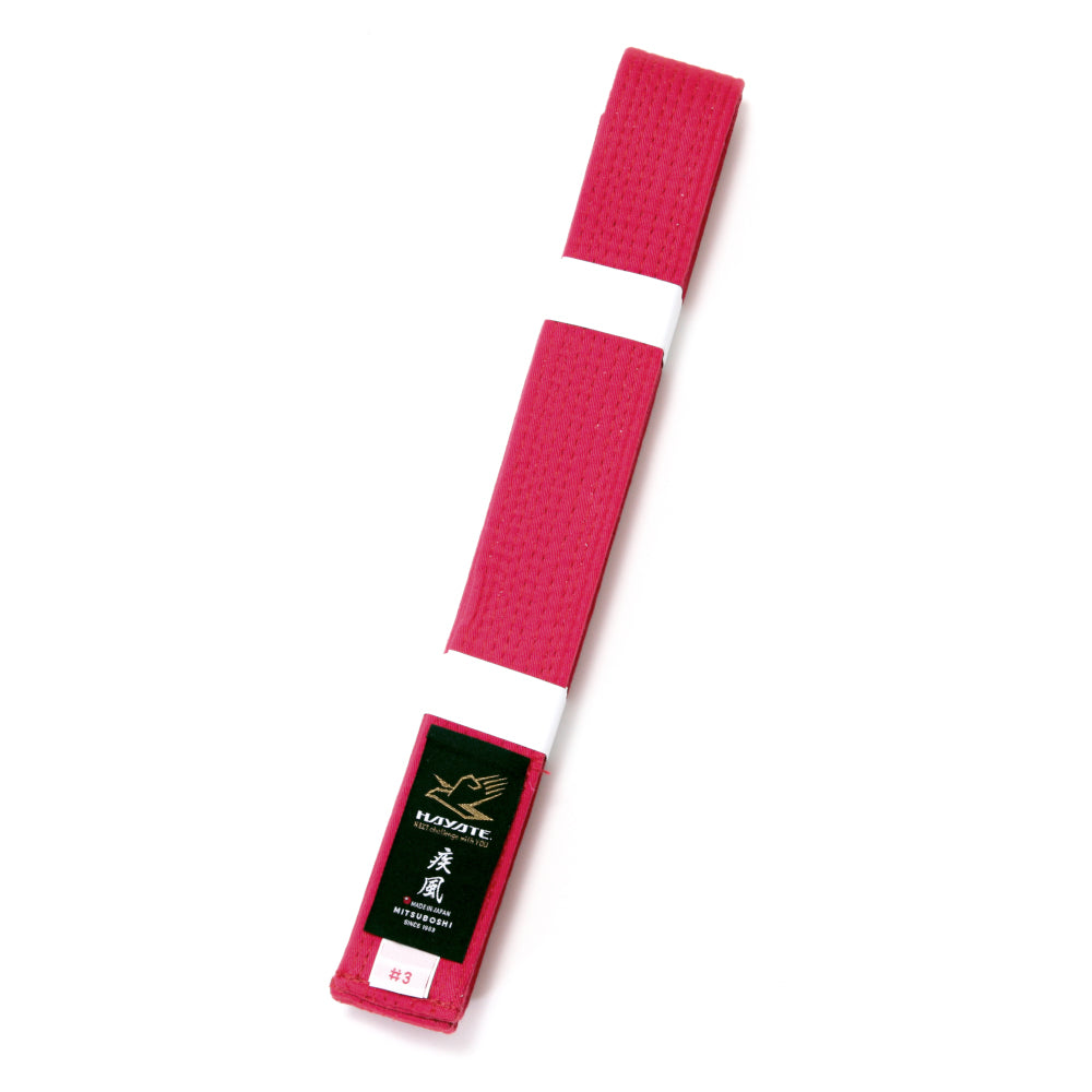 Red martial arts belt with Hayate brand label on a white background