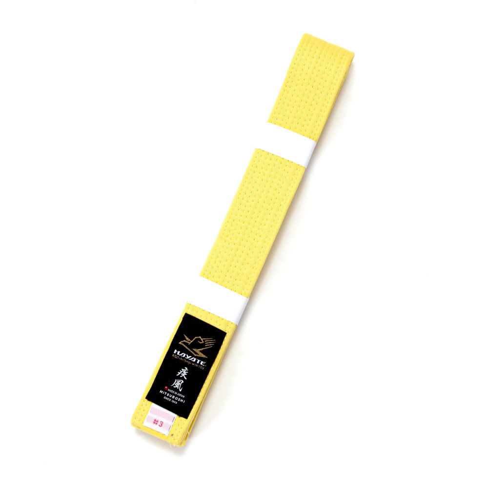 Yellow martial arts belt with a Hayate brand label on a white background